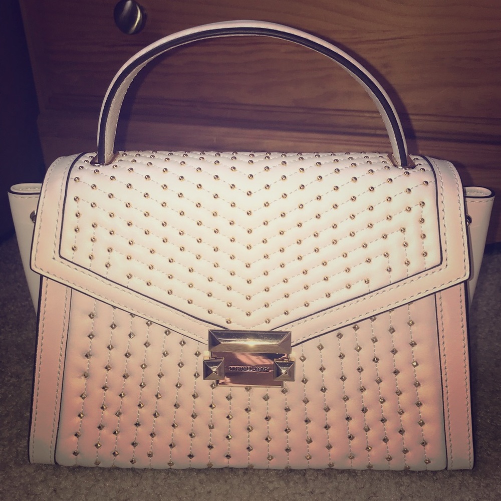 Optic white Michael Kors purse. Never been used.